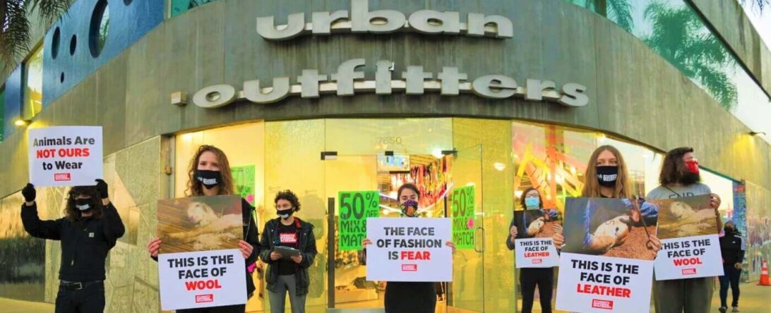 SOS students protest outside an Urban Outfitters store