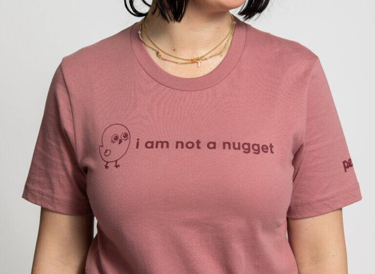 Close-up of shirt with "i am not a nugget" printed on it