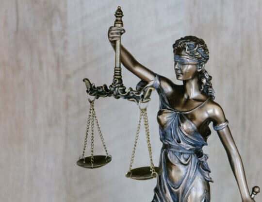 Image from Unsplash of the scales of justice